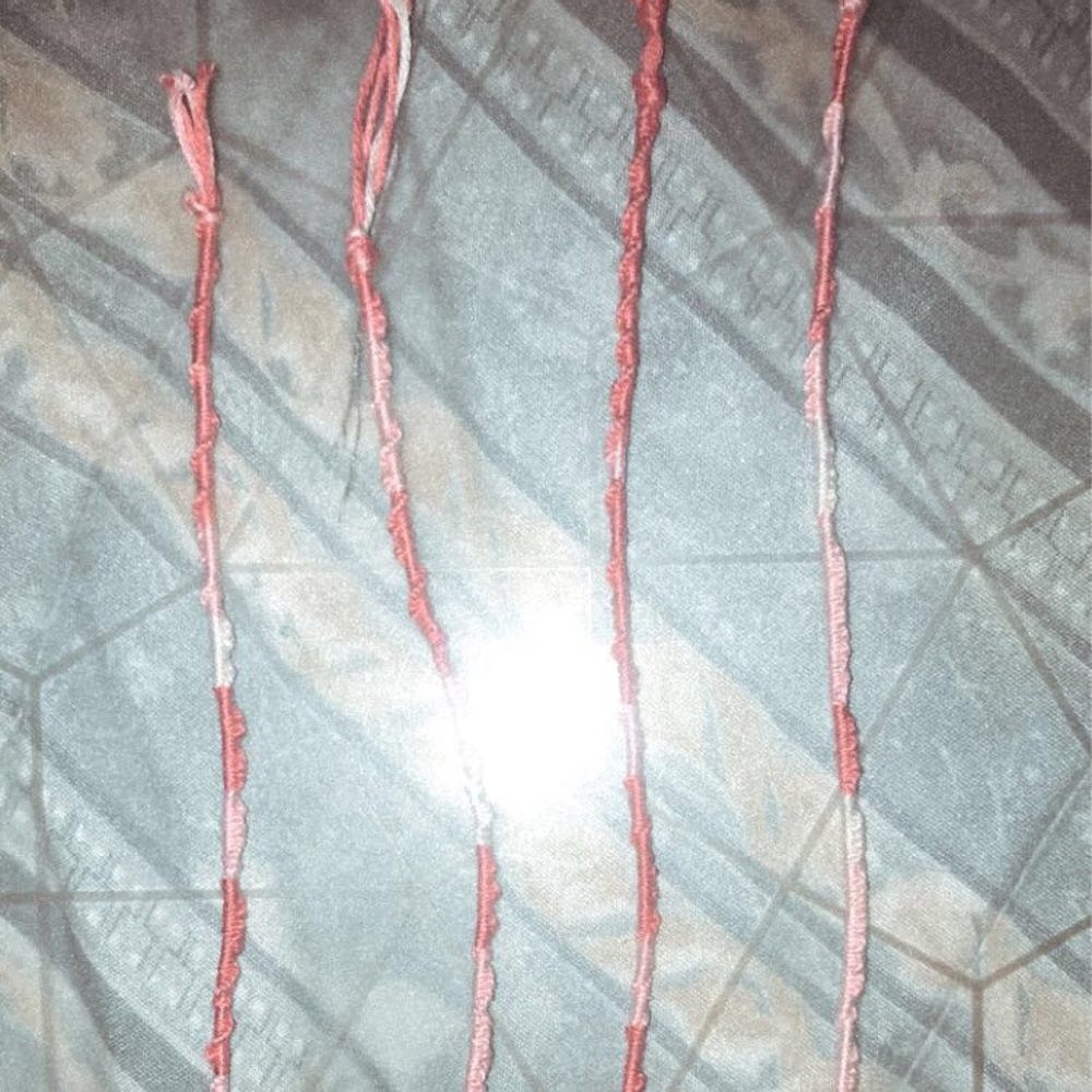 Pink faded spiral bracelets.